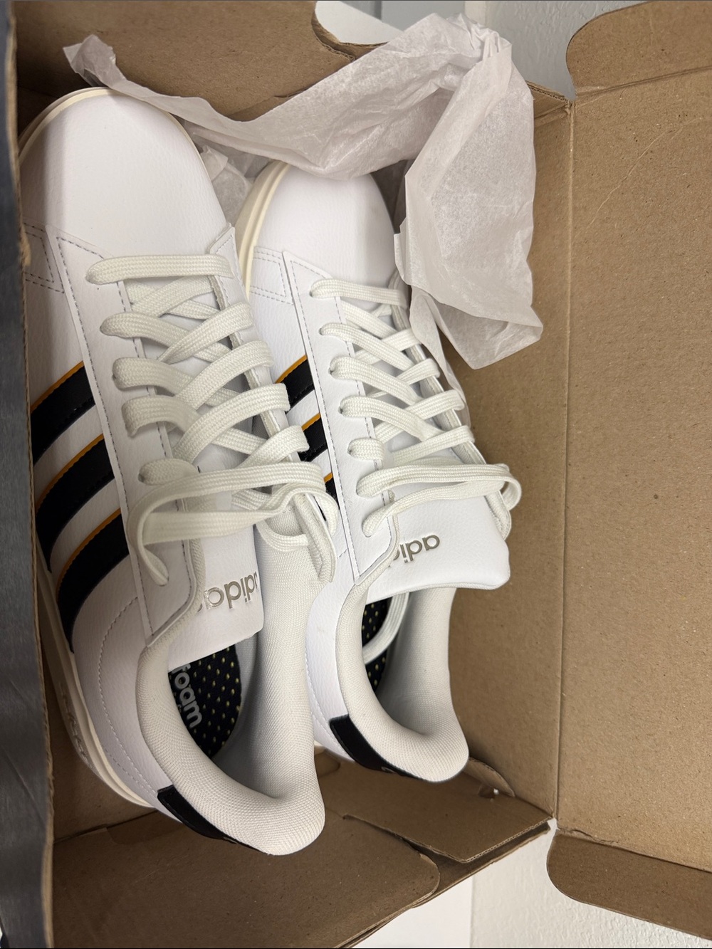 adidas Men’s White Sneakers with Black and Gold Stripe Detailing